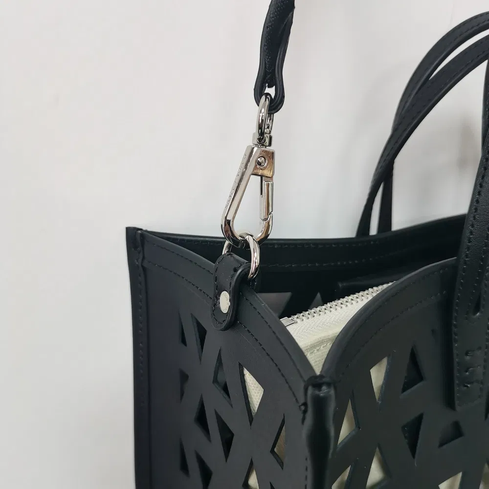 Black Laser-Cut Handbag with Removable Pouch for Modern Daily Use