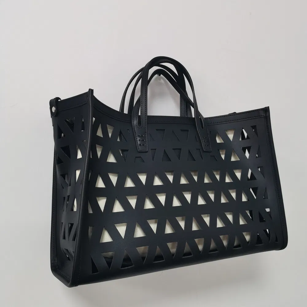 Black Laser-Cut Handbag with Removable Pouch for Modern Daily Use