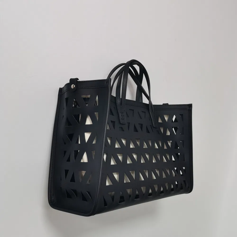 Black Laser-Cut Handbag with Removable Pouch for Modern Daily Use
