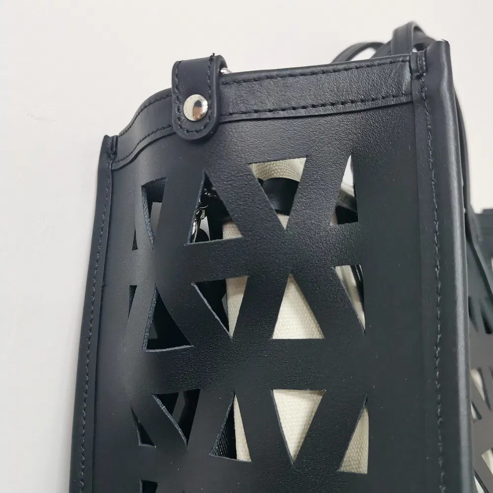 Black Laser-Cut Handbag with Removable Pouch for Modern Daily Use
