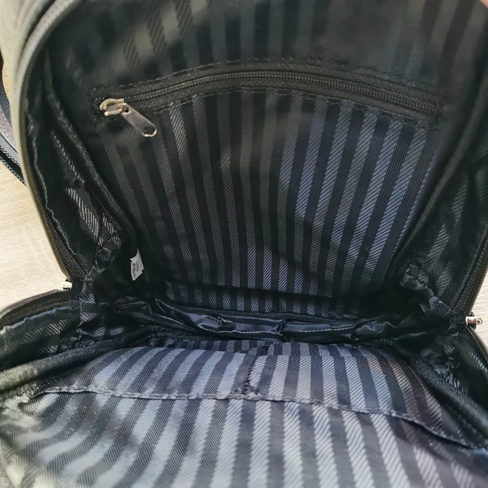 Compact Sports Sling Bag with Zippered Strap Pocket