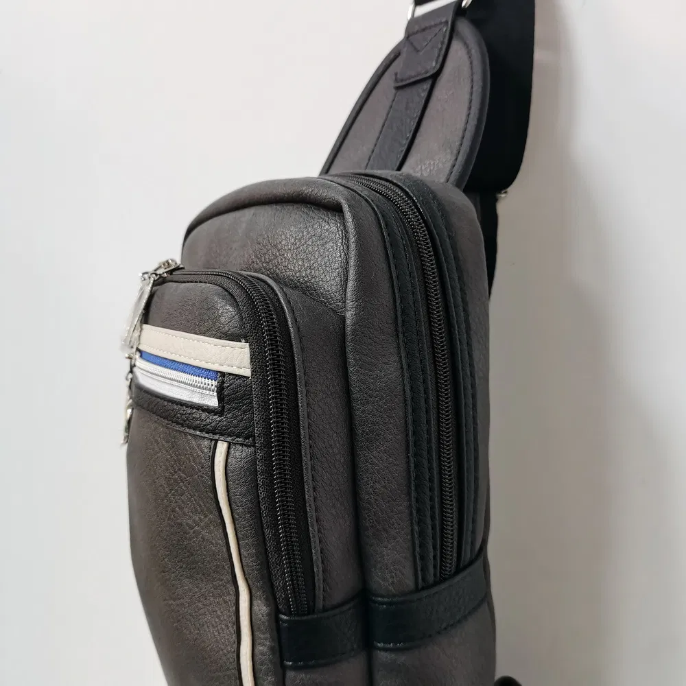 Compact Sports Sling Bag with Zippered Strap Pocket