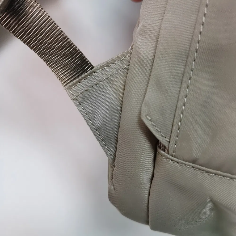 Multi-Compartment Nylon Tool Backpack with Slip Sleeves and Key Chain