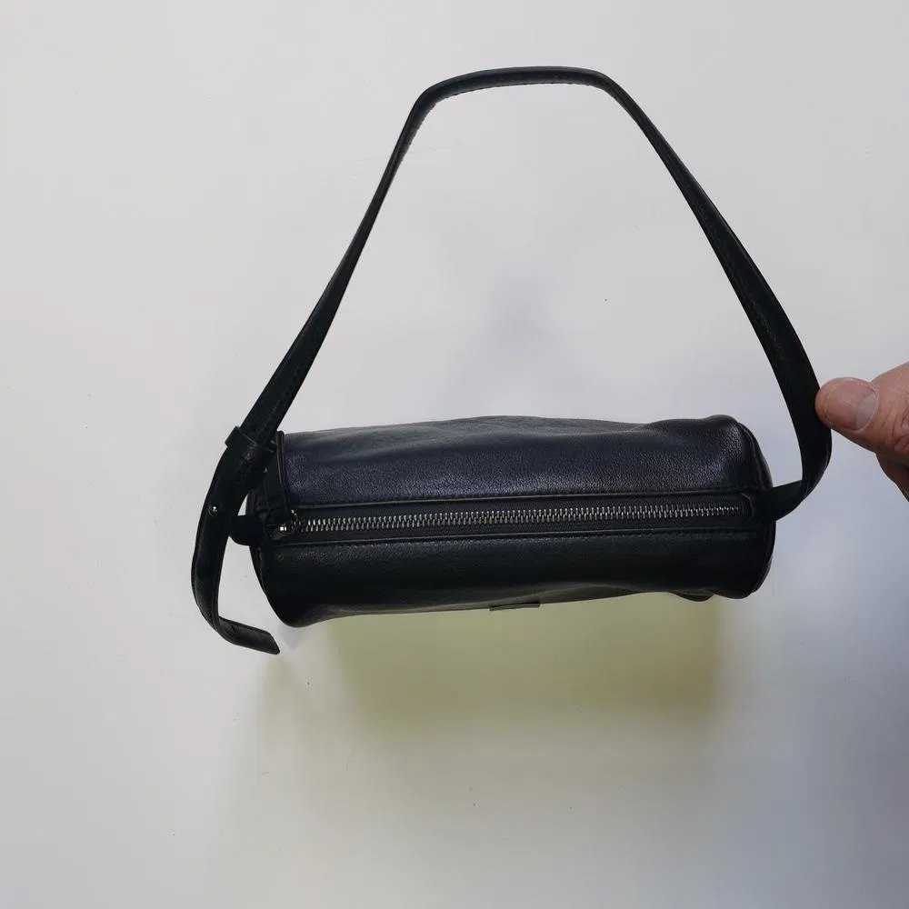 Sleek Black Cylindrical Shoulder Bag with Adjustable Strap