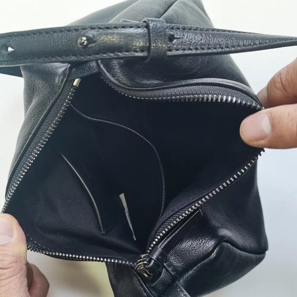 Sleek Black Cylindrical Shoulder Bag with Adjustable Strap